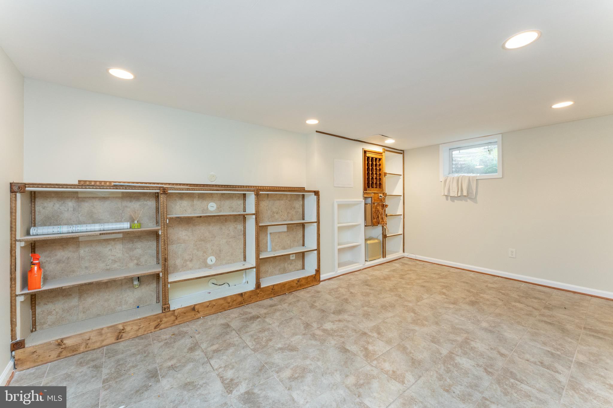 1609 Brisbane Street Silver Spring, MD 20902 - Photo 22 of 25 a view of an empty room with closet and racks