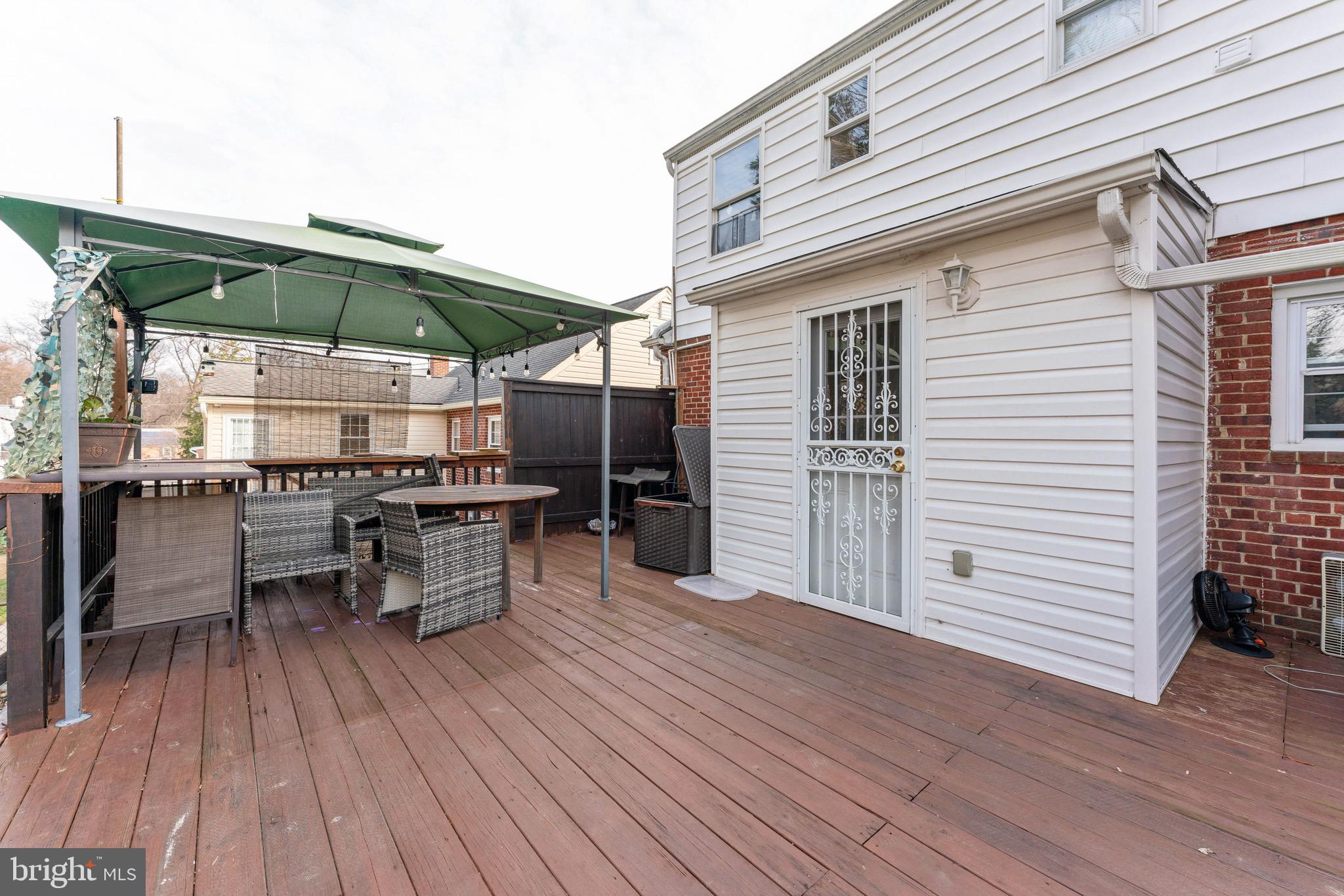 1609 Brisbane Street Silver Spring, MD 20902 - Photo 24 of 25 an outdoor space with furniture and umbrella