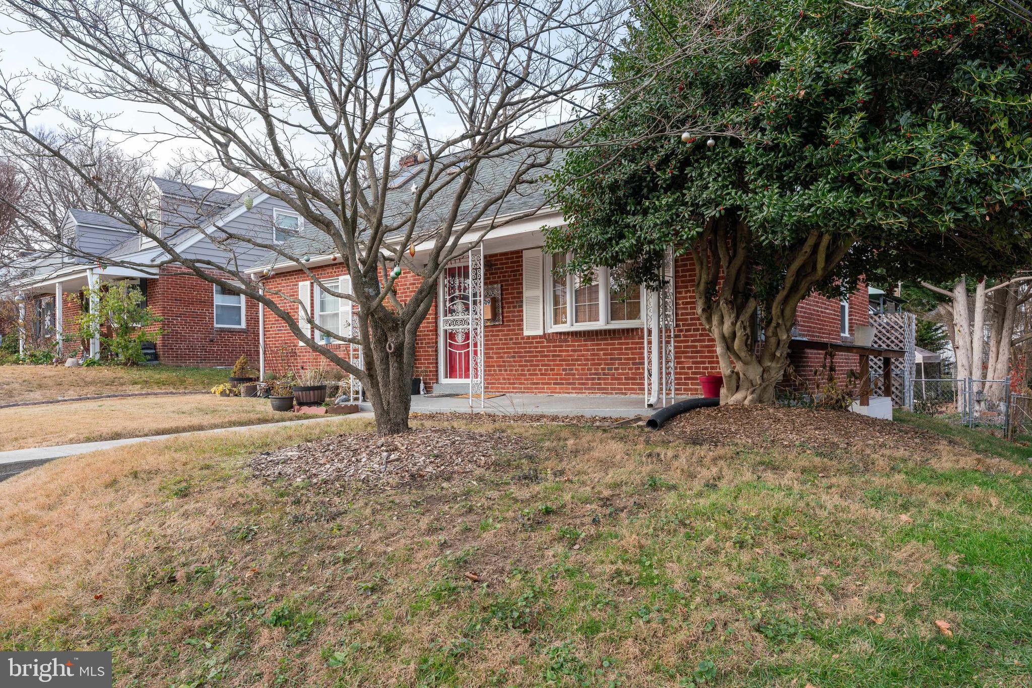 1609 Brisbane Street Silver Spring, MD 20902 - Photo 3 of 25 a view of a house with a yard