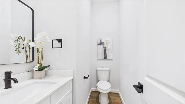 a living room with furniture a table and a painting