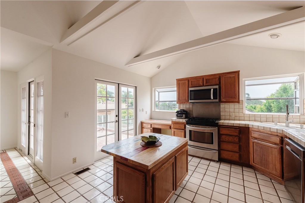 1166 Longfellow Drive Manhattan Beach, CA 90266 - Photo 13 of 47 a kitchen with a stove a sink and a refrigerator