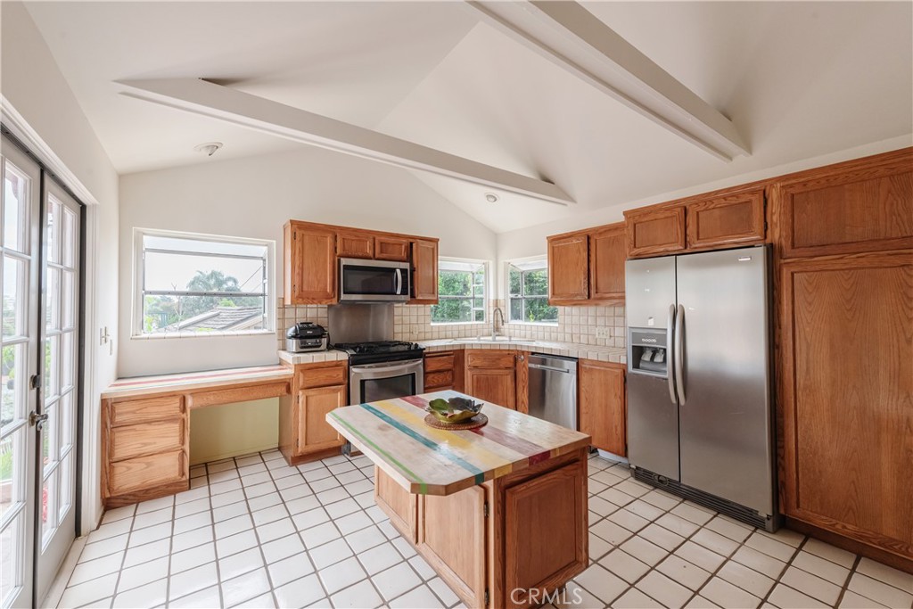 1166 Longfellow Drive Manhattan Beach, CA 90266 - Photo 14 of 47 a kitchen with stainless steel appliances granite countertop a sink stove and refrigerator