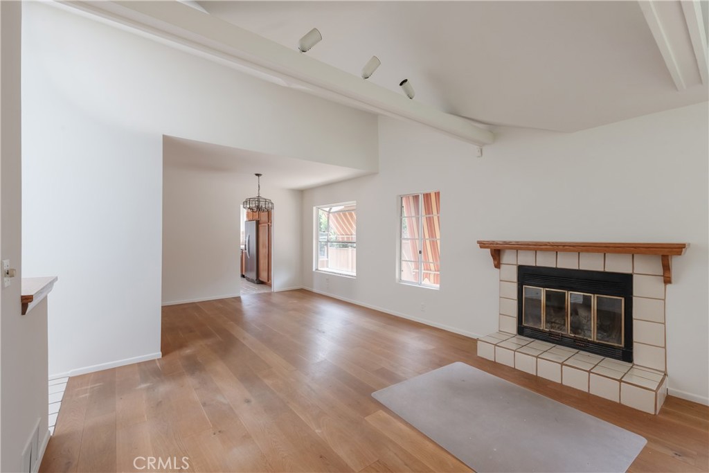 1166 Longfellow Drive Manhattan Beach, CA 90266 - Photo 16 of 47 a view of an empty room with window and fire place