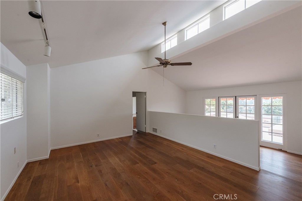 1166 Longfellow Drive Manhattan Beach, CA 90266 - Photo 24 of 47 a view of empty room with wooden floor and fan