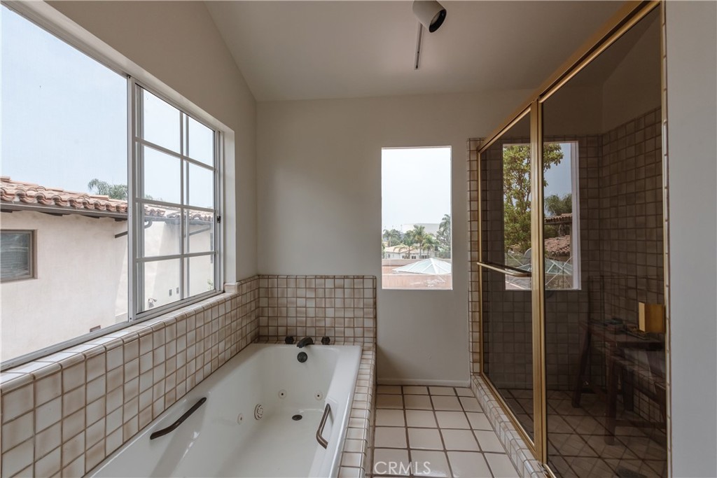 1166 Longfellow Drive Manhattan Beach, CA 90266 - Photo 27 of 47 a bathroom with a bathtub and a shower