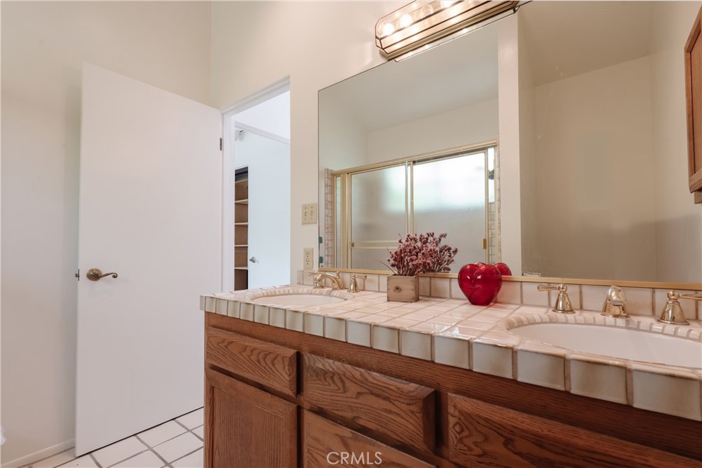 1166 Longfellow Drive Manhattan Beach, CA 90266 - Photo 29 of 47 a bathroom with a sink and a mirror