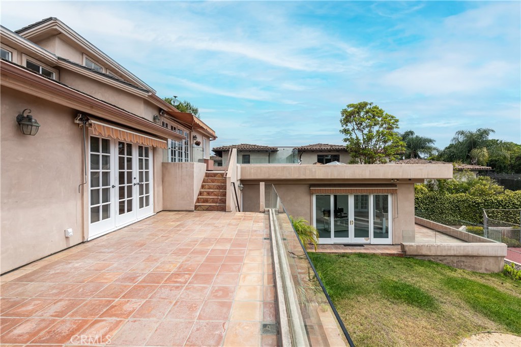 1166 Longfellow Drive Manhattan Beach, CA 90266 - Photo 35 of 47 a view of a house with a small yard and a large window