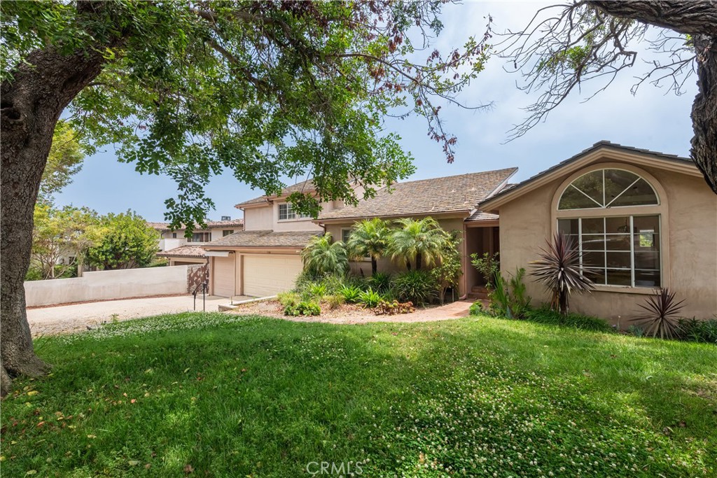 1166 Longfellow Drive Manhattan Beach, CA 90266 - Photo 46 of 47 a front view of a house with a yard and garage