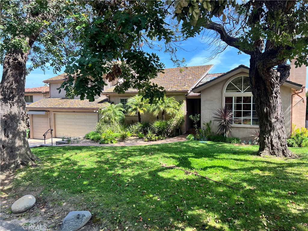 1166 Longfellow Drive Manhattan Beach, CA 90266 - Photo 6 of 47 a view of a house with a yard plants and large tree