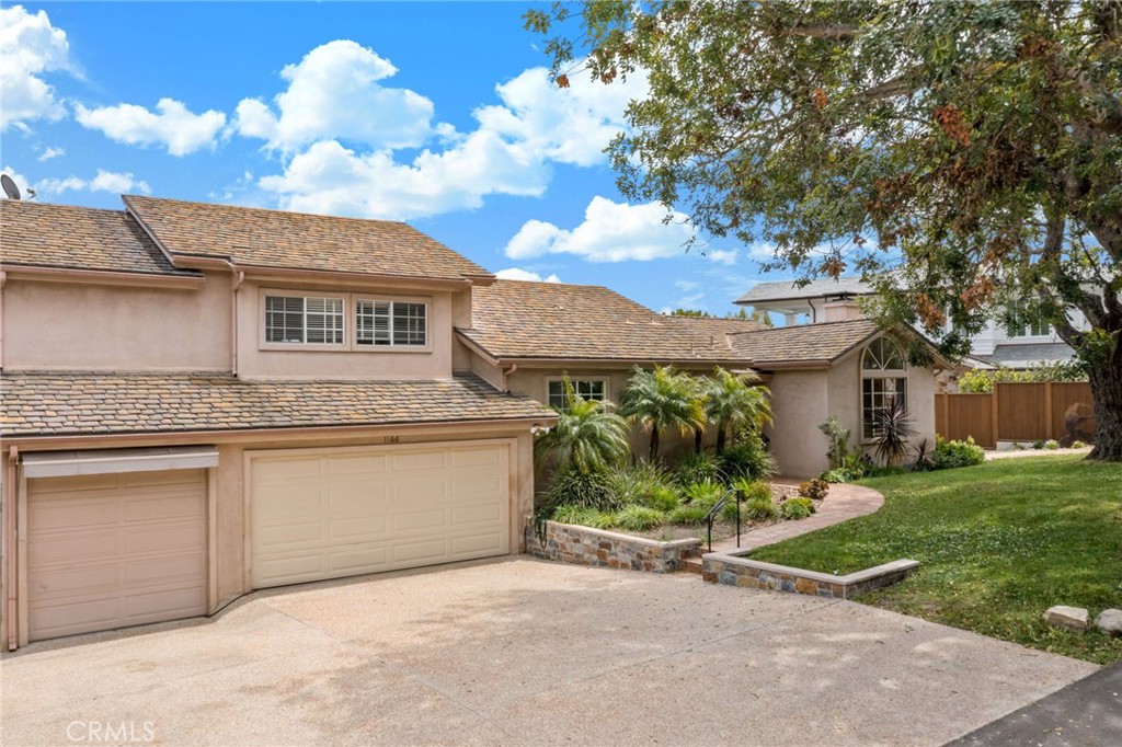 1166 Longfellow Drive Manhattan Beach, CA 90266 - Photo 9 of 47 front view of a house with a yard