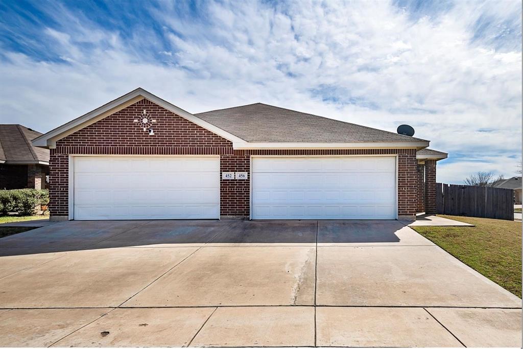 452 Canvas Court Crowley, TX 76036 - Photo 1 of 11 a front view of a house with a garage