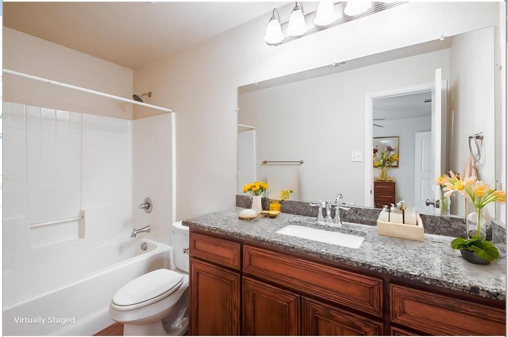 452 Canvas Court Crowley, TX 76036 - Photo 11 of 11 a bathroom with a granite countertop sink toilet and shower