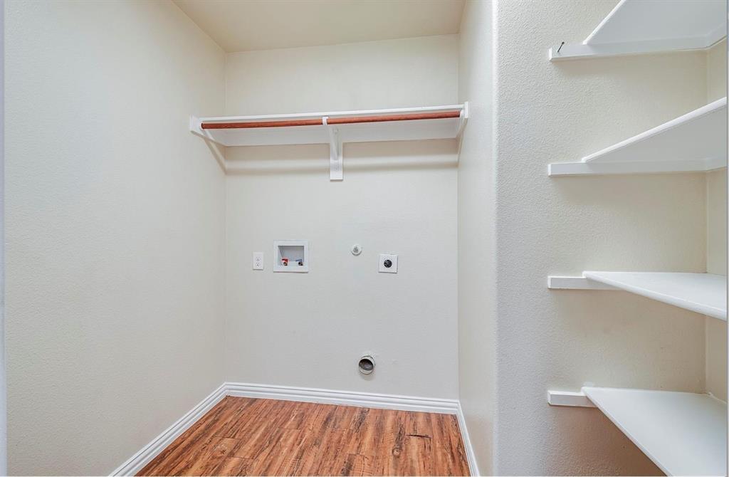 452 Canvas Court Crowley, TX 76036 - Photo 8 of 11 a view of small space with racks on the wall