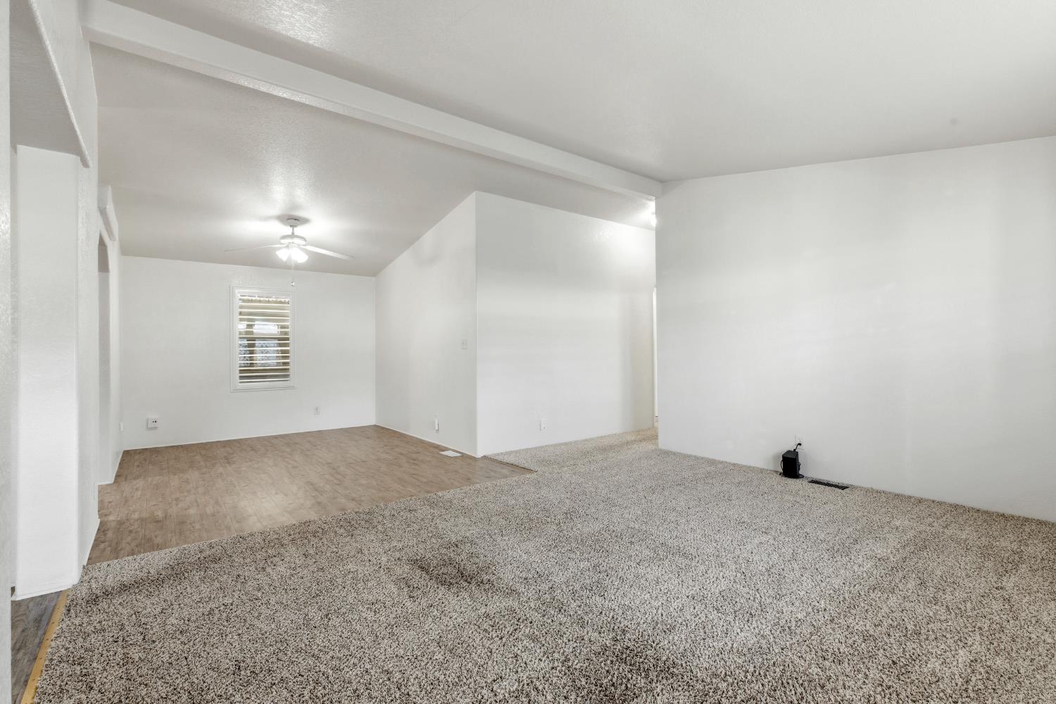 2113 Barrington Lane Modesto, CA 95350 - Photo 11 of 32 a view of an empty room and wooden floor