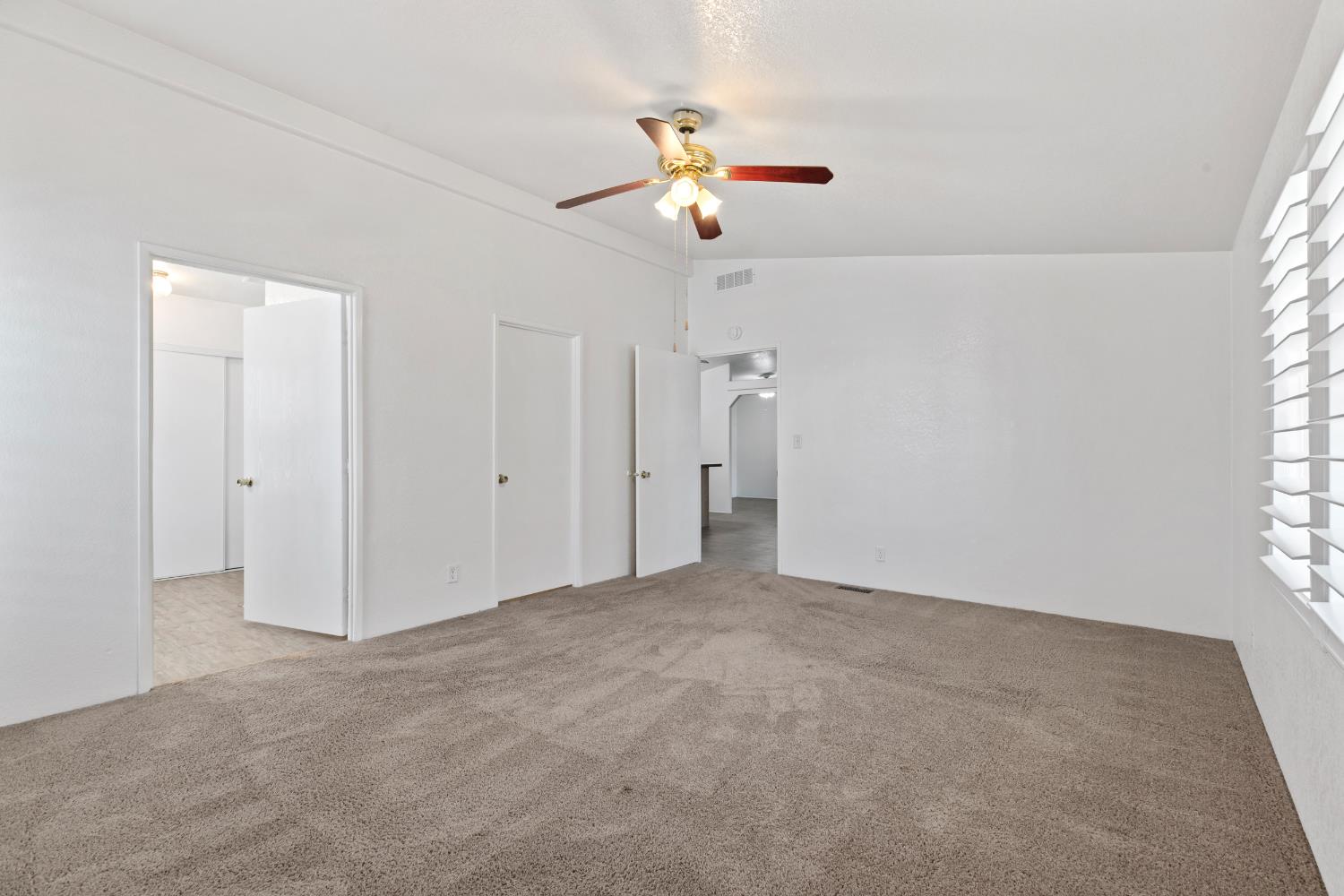 2113 Barrington Lane Modesto, CA 95350 - Photo 16 of 32 a view of a livingroom with a ceiling fan and window