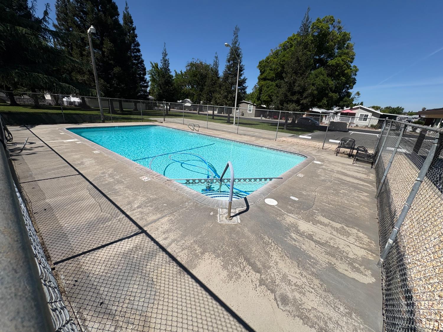 2113 Barrington Lane Modesto, CA 95350 - Photo 29 of 32 a view of a swimming pool with a lounge chair