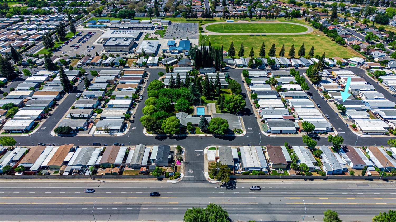 2113 Barrington Lane Modesto, CA 95350 - Photo 31 of 32 an aerial view of a city with lots of residential buildings and parking space