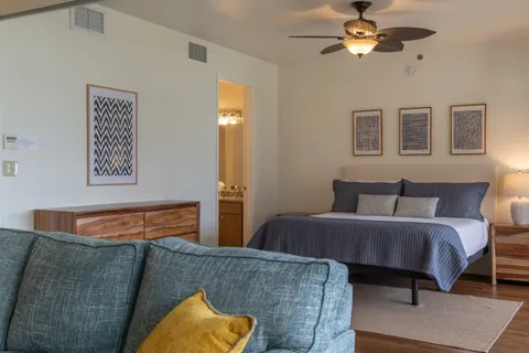 a bed room with a bed and a couch