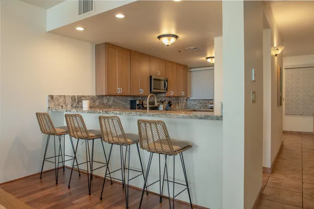 a view of kitchen and dining area with furniture