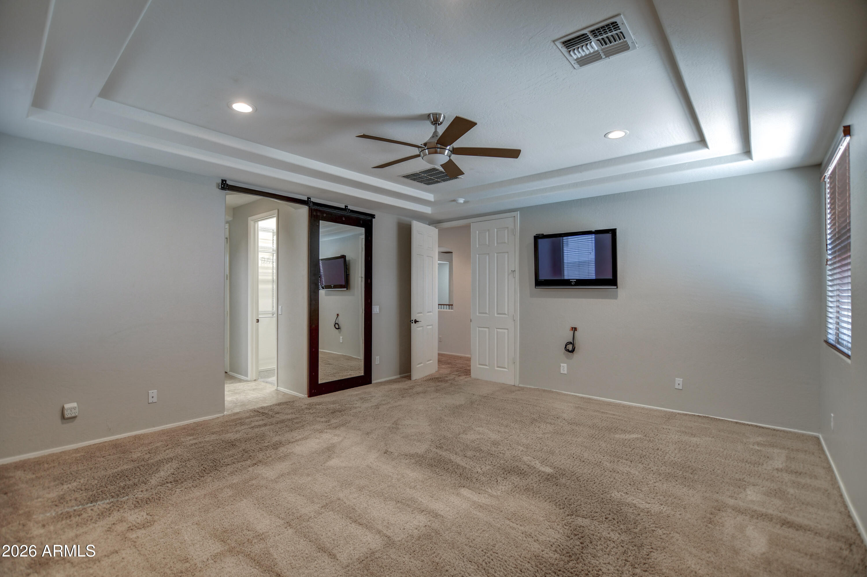 3078 East Muirfield Street Gilbert, AZ 85298 - Photo 62 of 92 a view of a livingroom with a ceiling fan and window