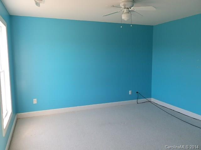 700 Mt Vernon Road Woodleaf, NC 27054 - Photo 8 of 24 an empty room with a window