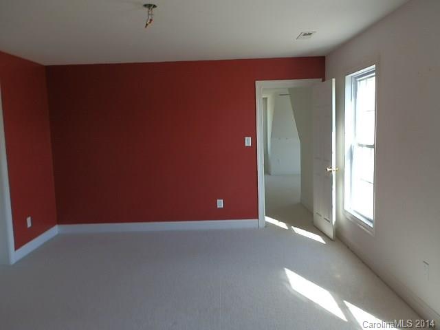 700 Mt Vernon Road Woodleaf, NC 27054 - Photo 9 of 24 an empty room with windows