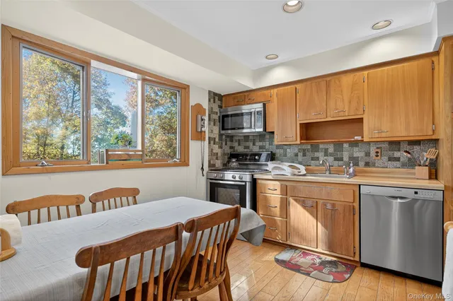 a kitchen with a stove a sink and a refrigerator