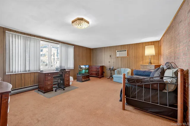 a bedroom with furniture and a window