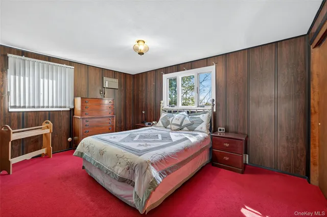 a bedroom with a bed and a closet