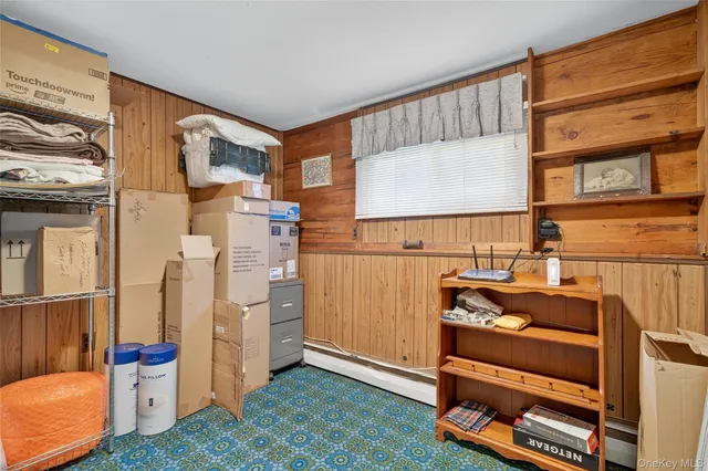 a view of living room with furniture and a window