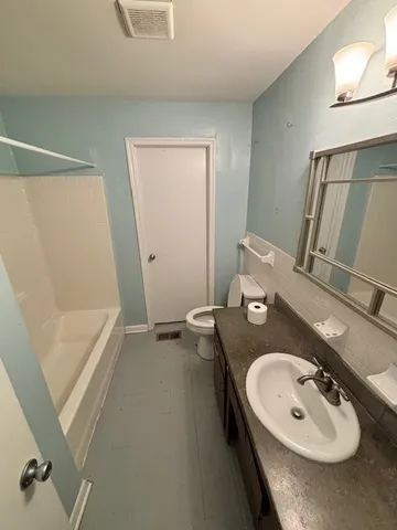 a bathroom with a sink and mirror