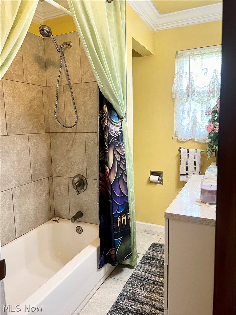 10071 Hazelton Road Streetsboro, OH 44241 - Photo 12 of 16 Bathroom featuring crown molding, tile flooring, shower / tub combo with curtain, and vanity