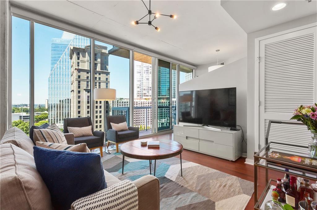a living room with furniture and a flat screen tv