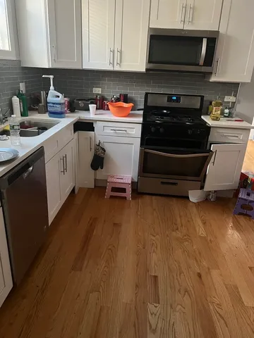 a kitchen with a sink and cabinets
