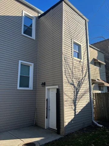 a view of a house with wooden deck