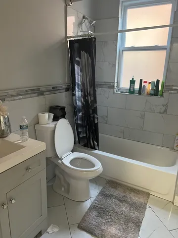 a bathroom with a toilet and a sink