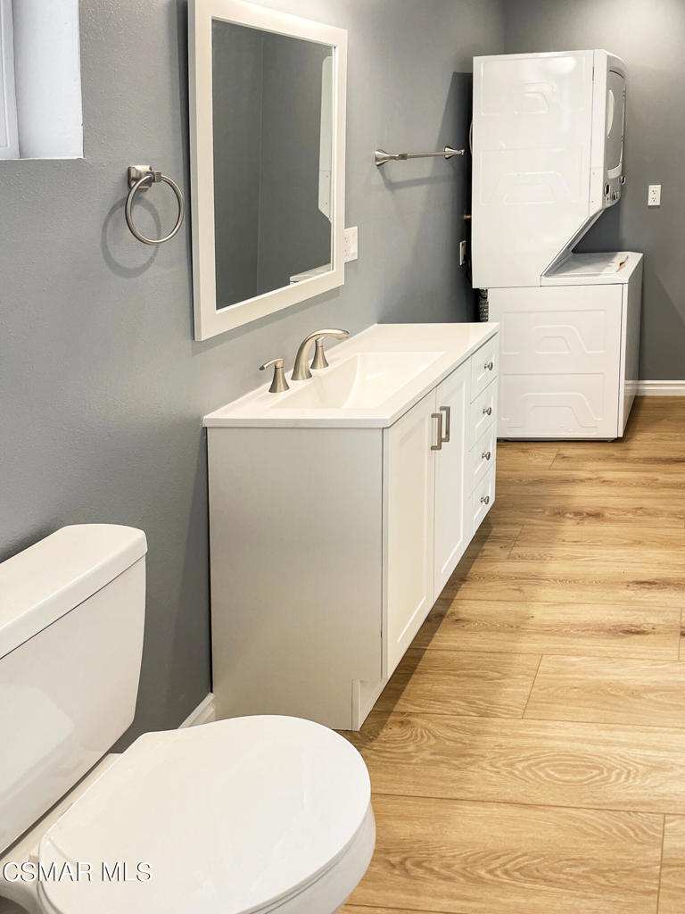2142 Heywood Street, Unit A Simi Valley, CA 93065 - Photo 11 of 14 a white toilet sitting next to a bathroom sink