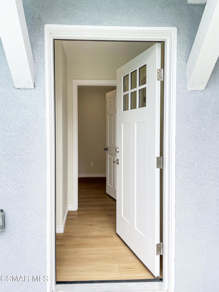 2142 Heywood Street, Unit A Simi Valley, CA 93065 - Photo 3 of 14 a view of a hallway with wooden floor