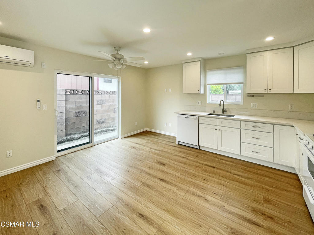 2142 Heywood Street, Unit A Simi Valley, CA 93065 - Photo 6 of 14 a view of a kitchen with wooden floor and a sink