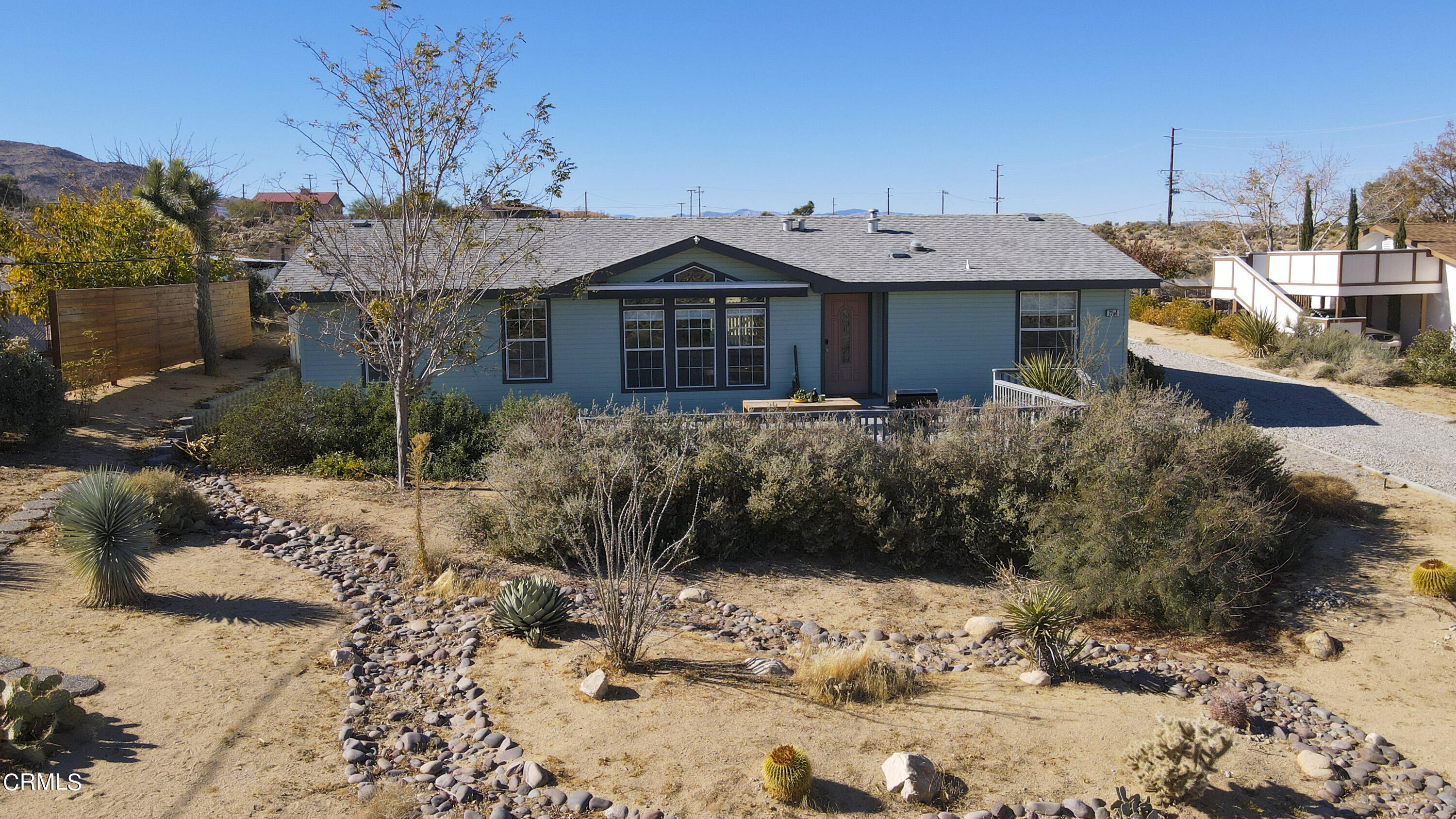 7354 Quail Springs Road Joshua Tree, CA 92252 - Photo 48 of 56 a view of a house with a yard covered in snow