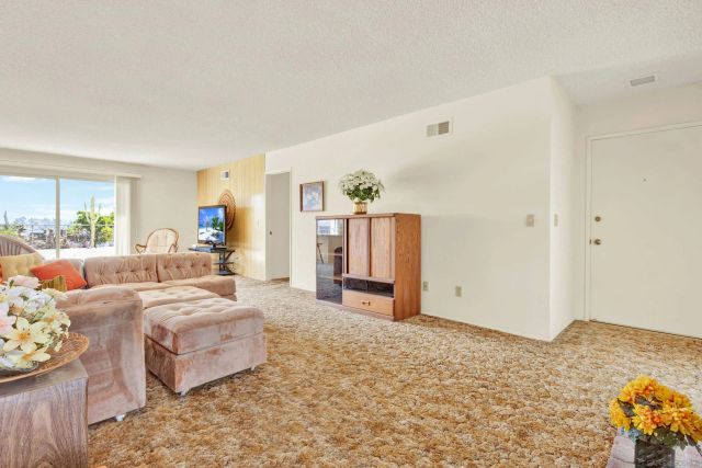 a bedroom with furniture and a bed