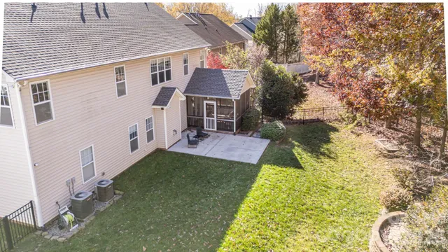 a view of house with backyard
