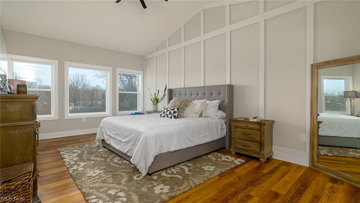 1849 Fixler Road Wadsworth, OH 44281 - Photo 11 of 39 Bedroom featuring dark wood-type flooring, vaulted ceiling, and ceiling fan