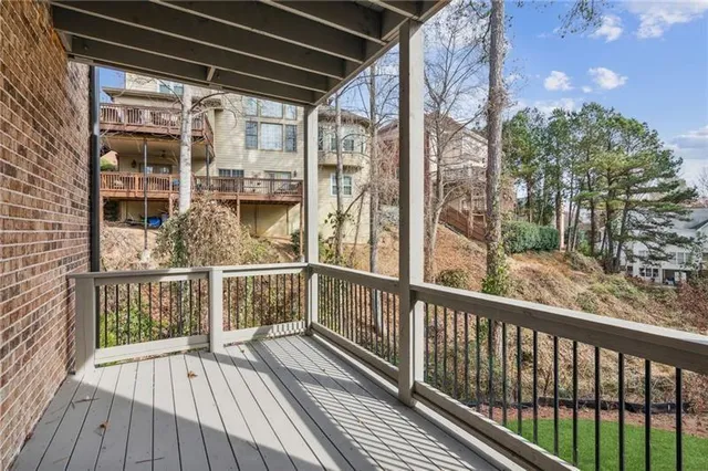 a view of a balcony with wooden floor