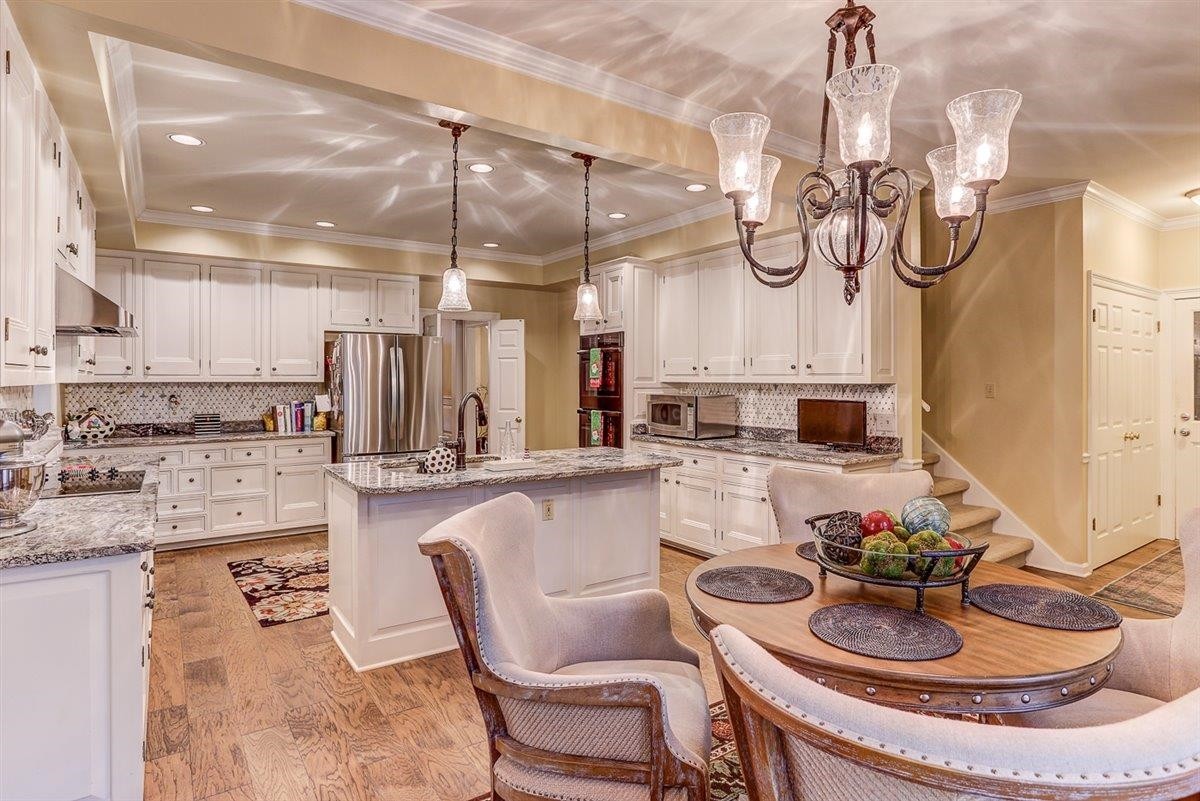 6648 Rue Beaumonde Drive Memphis, TN 38120 - Photo 12 of 20 a kitchen with stainless steel appliances granite countertop a sink and cabinets