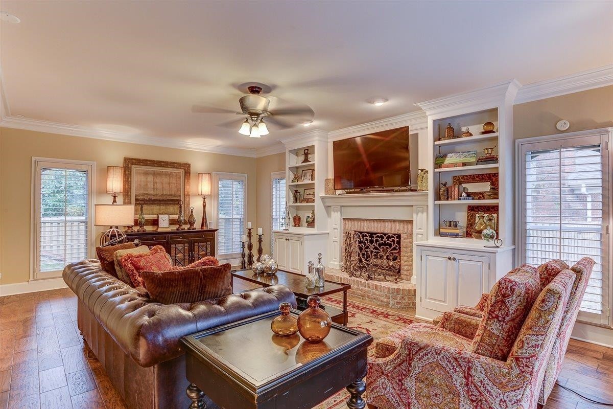 6648 Rue Beaumonde Drive Memphis, TN 38120 - Photo 8 of 20 a living room with fireplace furniture and a flat screen tv