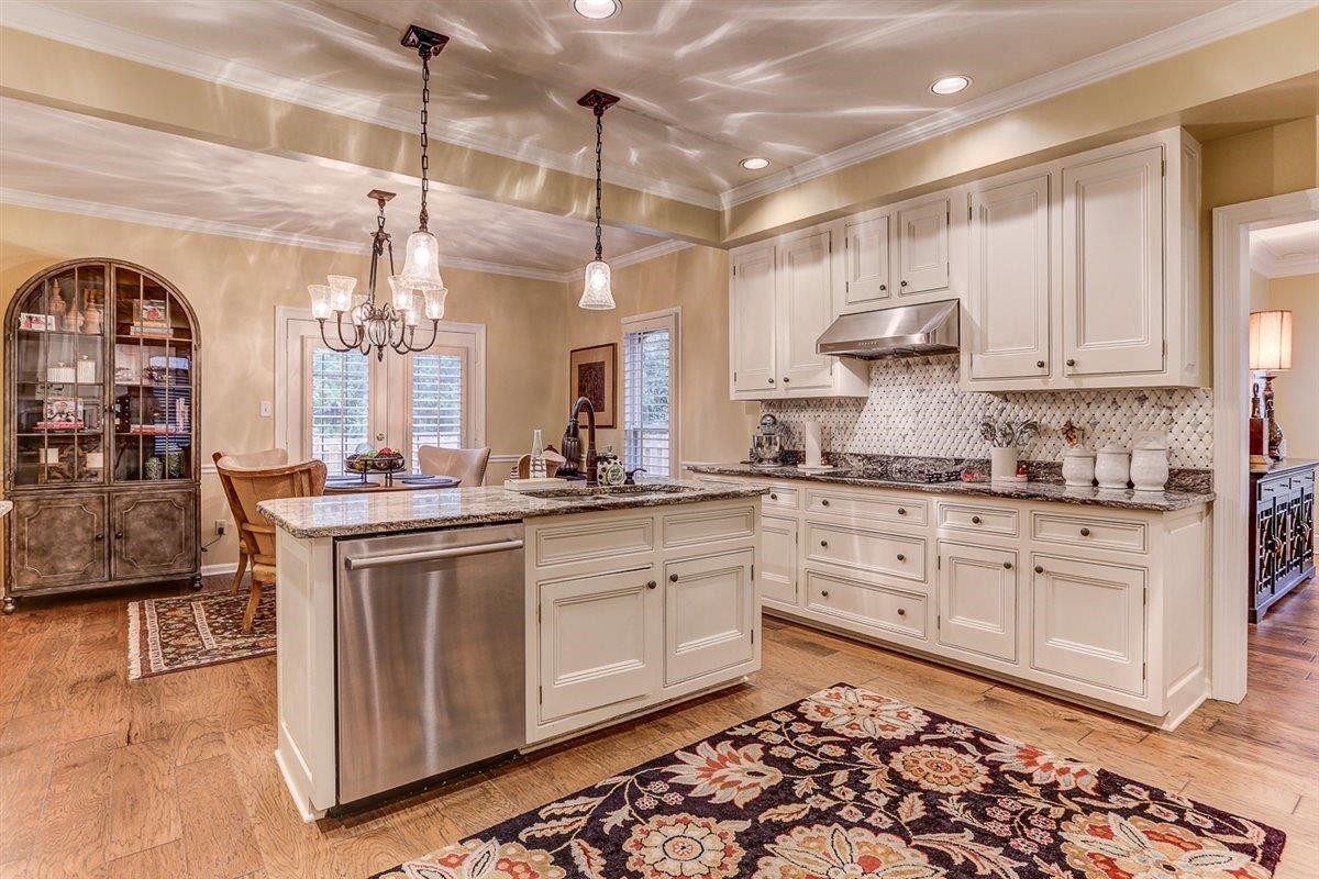 6648 Rue Beaumonde Drive Memphis, TN 38120 - Photo 9 of 20 a kitchen with stainless steel appliances granite countertop a sink a stove and cabinets