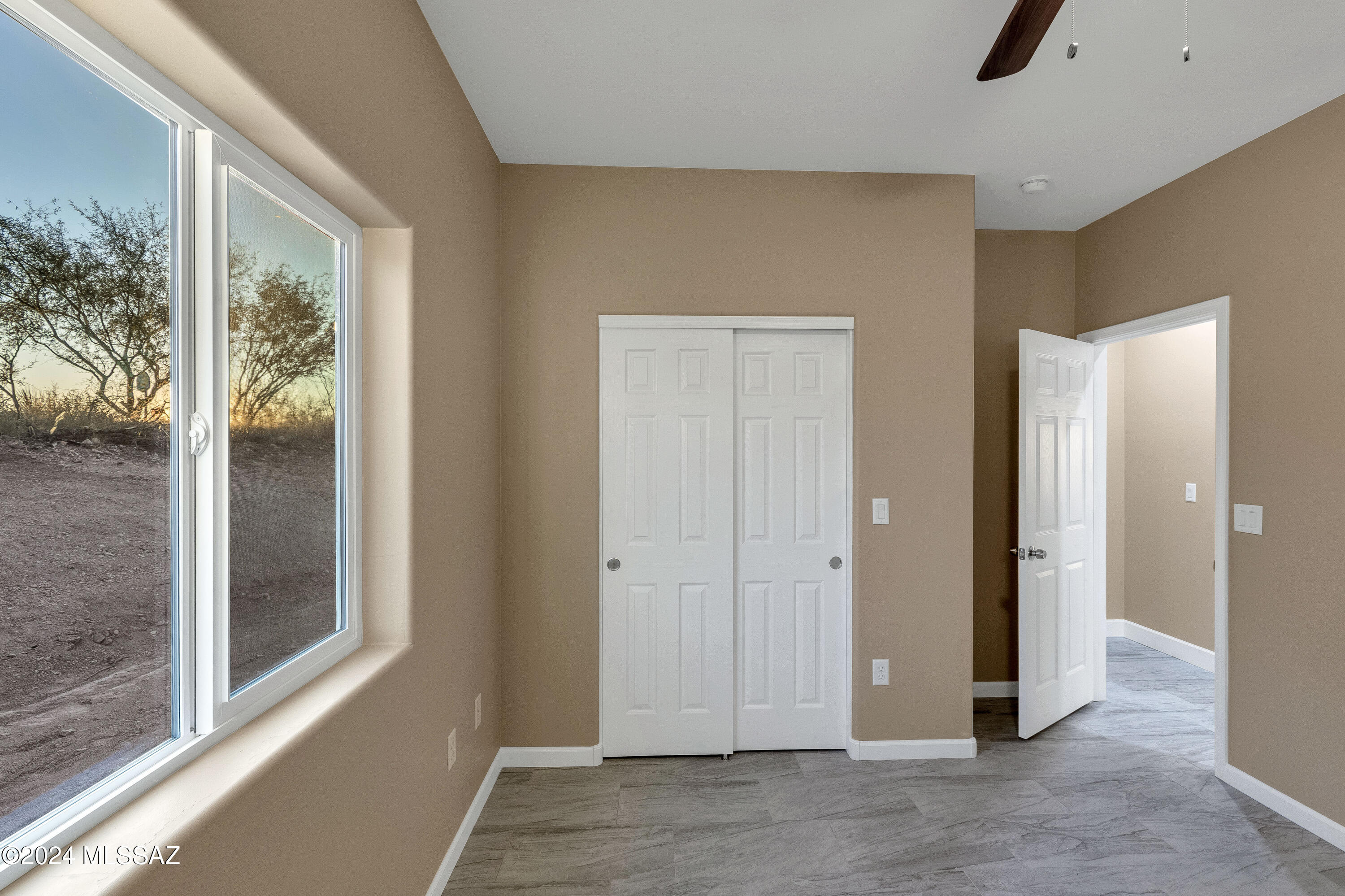 221 Paseo Mascota Rio Rico, AZ 85648 - Photo 35 of 45 a view of a hallway with wooden floor and windows