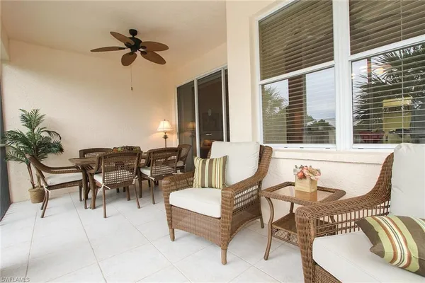 a view of a patio with a dining table and chairs