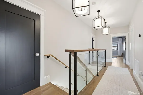 a bedroom with bed and wooden floor